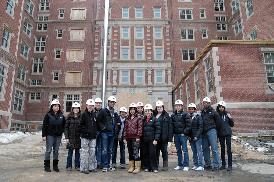 A tour group pauses outside the main entrance to Maseeh Hall. The tours took students through the lobby, the dining hall, some common areas, and into one of the floors to check out student rooms.