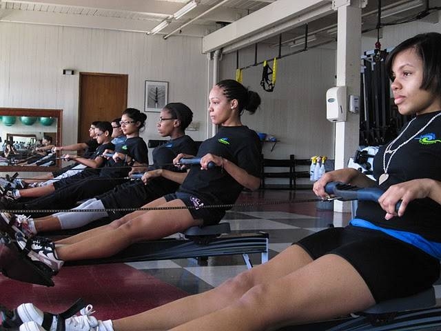 Students sit ready at the 'finish,' a specific technique of the rowing stroke at the Pierce Boathouse.