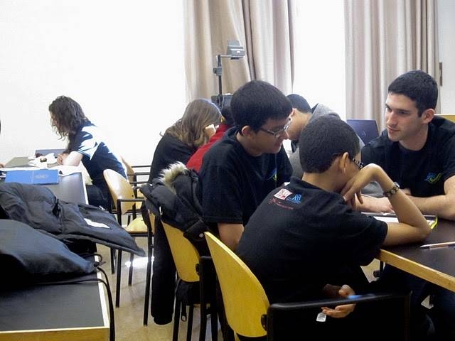 Co-founder and tutor, Noam Angrist, reads The Economist with the students, who have picked an article to synthesize and present to the class.