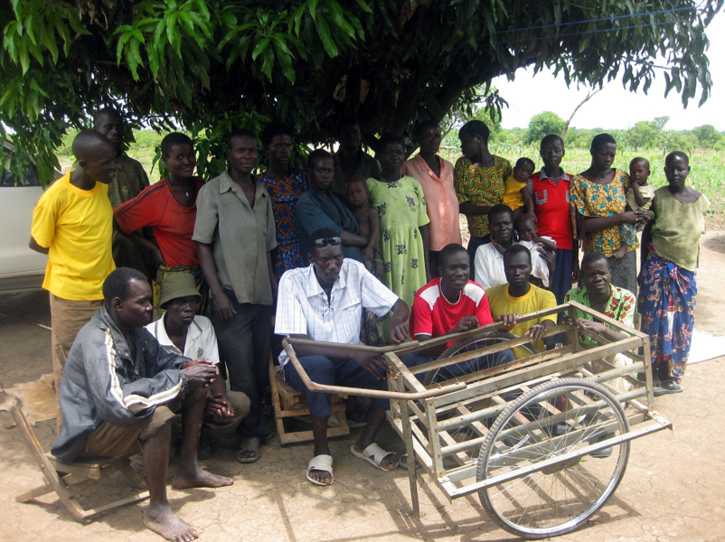 Workshop participants designed a cart for hauling cans of water, which they built from a discarded bed frame. The cart saves them seven round-trips to the well every day.