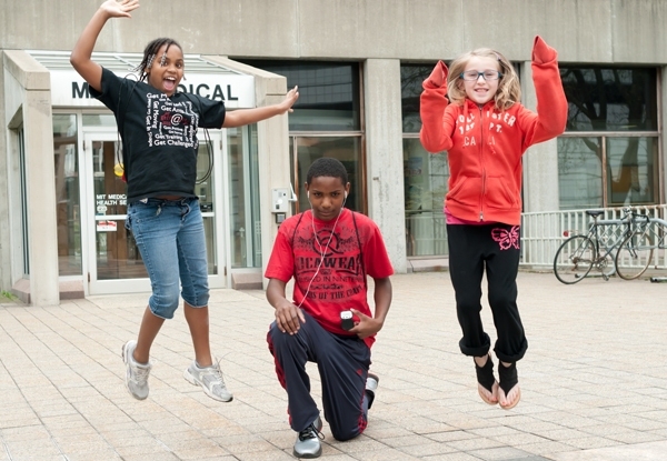 Visitors to MIT's open house on April 30 show off their free pedometers from MIT Medical.