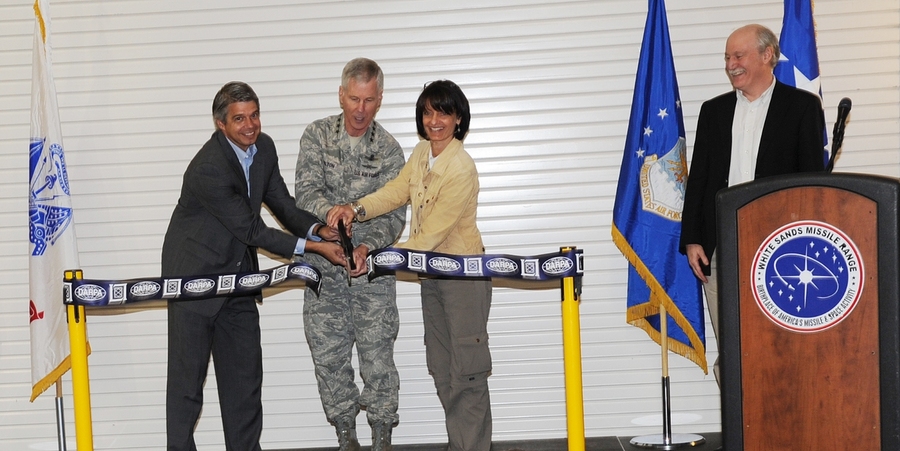 Cutting the ribbon to 'inaugurate' the Space Surveillance Telescope (SST) are, from left to right, Eric Evans, director of MIT Lincoln Laboratory; General William Shelton, commander of Air Force Space Command; and Dr. Regina Dugan, director of the Defense Advanced Research Projects Agency, which sponsored the development of the SST. At the podium is Grant Stokes, head of the Aerospace Division, wh...