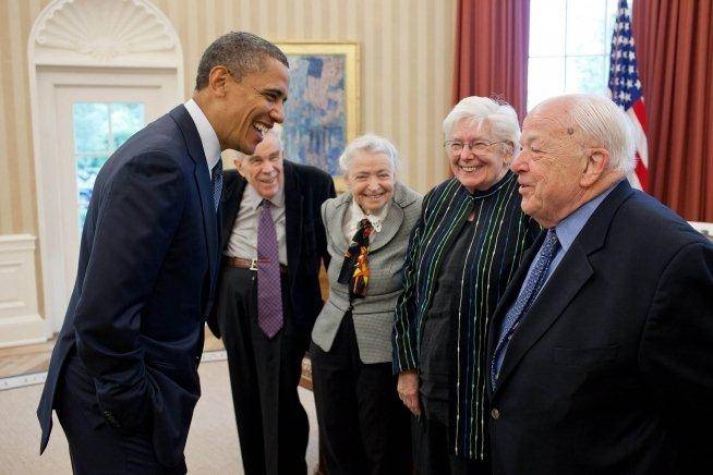 President Barack Obama greets 2012 Fermi Award recipients Dr. Burton Richter '52, PhD '56, right, and his wife, Laurose; and Dr. Mildred S. Dresselhaus, third from right, and her husband Gene, in the Oval Office.