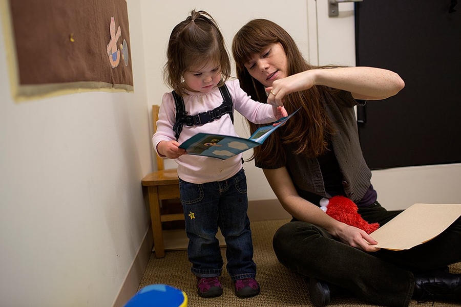 Melissa Kline, right, graduate student in the Department of Brain and Cognitive Sciences, examines language usage and development in young children. The goal in this experiment is to see what words Madeline uses to describe a situation indicated by pictures.