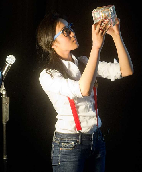 A student from Team Lobster demonstrates "The Cube," a variation on the Rubik's Cube in which metal balls inside the cubes must be guided through a set of internal mazes.