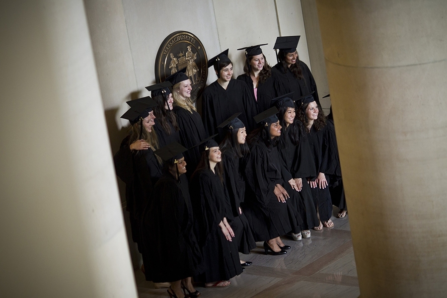 A group of advanced degree candidates posed for pictures.