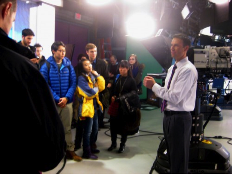 Todd Gutner, WBZ TV's meteorologist, talks with IAP students.