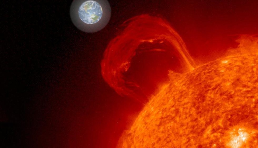 Photo illustration of the sun with a giant loop of gas (a sun flare) coming off of it
