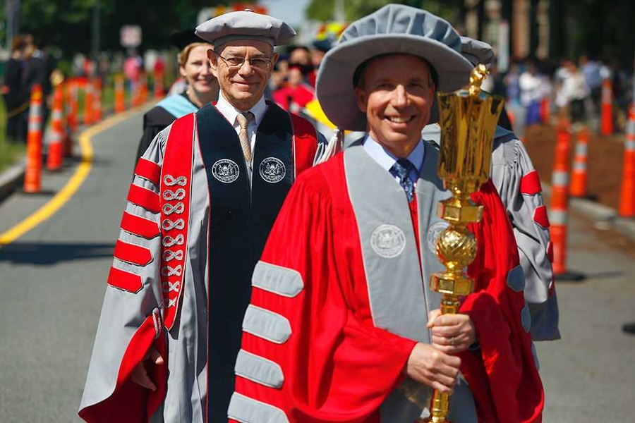 Chief Marshal John W. Jarve '78, president of the MIT Alumni Association, led the procession into Killian Court, carrying the Institute's ceremonial, beaver-topped mace. He was followed by MIT President L. Rafael Reif and Commencement speaker Ellen Kullman, CEO and chair of DuPont.