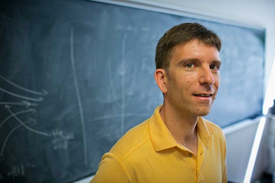 MIT mathematics professor William Minicozzi in his office at Building E17. Minicozzi studies the theory of surface tension in solutions.