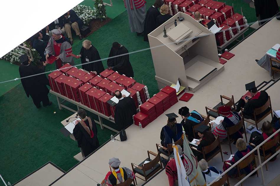 Diplomas are meticulously arranged on the stage for distribution to 2,707 graduates -- each of whom is called to the stage individually to receive his or her actual diploma from MIT's president or provost.