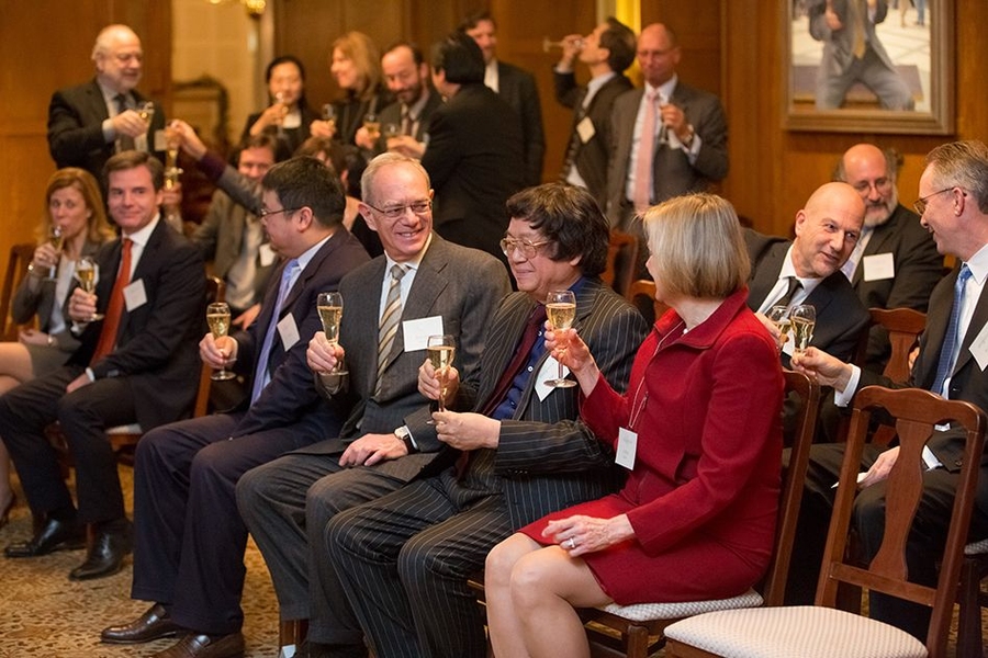 MIT President L. Rafael Reif and Christine Reif toast Samuel Tak Lee at the signing ceremony formalizing Lee's $118 million gift to MIT.