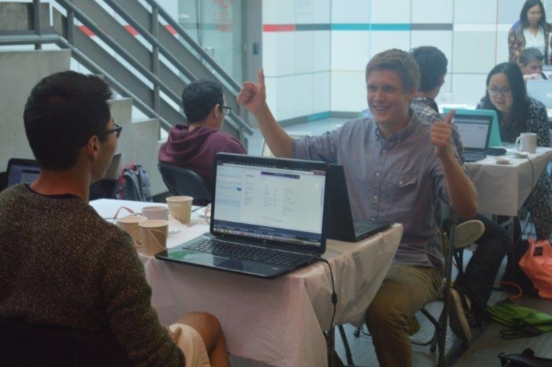 Thumbs-up signal from a Clean Earth Hackathon team