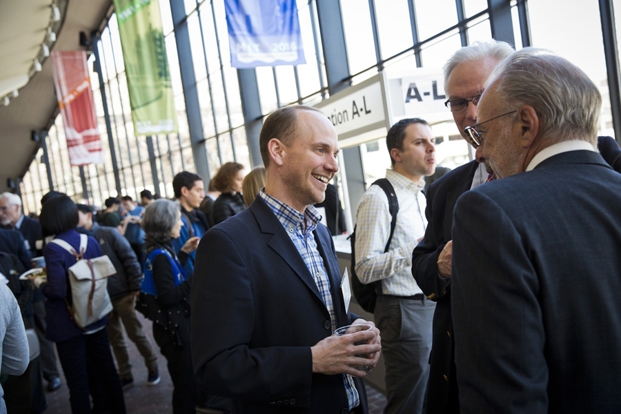 MIT Professor John Ochsendorf speaks with guests before the symposium.