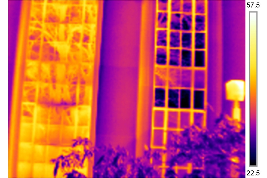In the left side of the infrared image, the existing windows are single-pane glass and are conducting heat to the outdoor environment. In the right side of the image, the replacement window consisting of vacuum-insulated glass is conducting very little heat to the outdoor environment. The darker color indicates very thermal transfer, and the lighter color indicates a large level of thermal transfe...