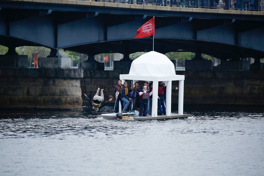 A team member jumps off the MIT “Dome Raft,” a project led by Stanislaw Kowalcyzk, a student at the MIT Sloan School of Management.