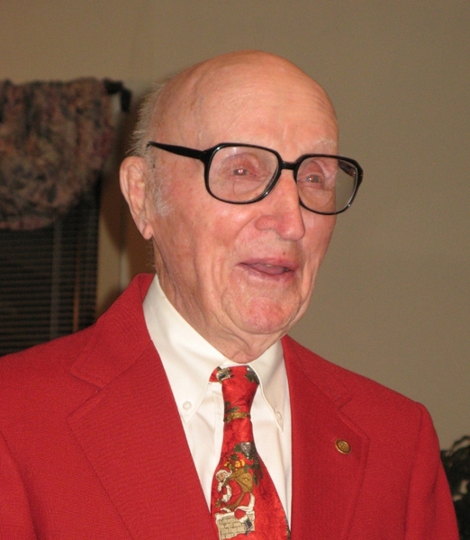 Robert Smith ’41, in his signature MIT red jacket, celebrates his 90th birthday.
