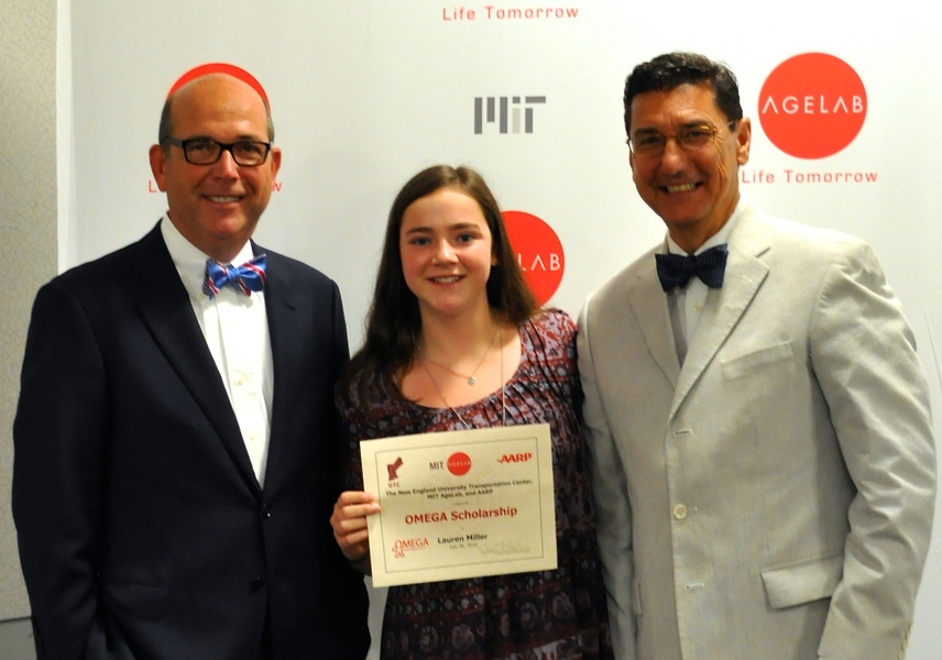 MIT AgeLab's Joe Coughlin (left) and AARP's Michael E. Festa (right) present the inaugural OMEGA award to Lauren Miller.