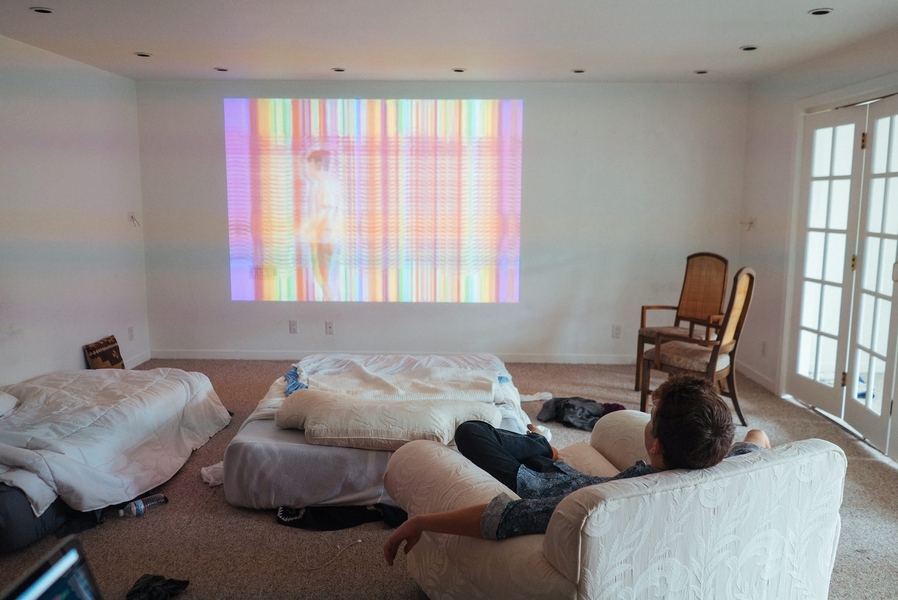 MIT senior Guillermo Webster relaxes downstairs at the “Sandcastle,” which is in Miraloma, an upscale San Francisco neighborhood of curving hilltop streets and Art Deco homes. It is a fair bet that most other residents do not, like Kwok and Webster, sleep on air mattresses; spending money on a bed never even occurred to them.