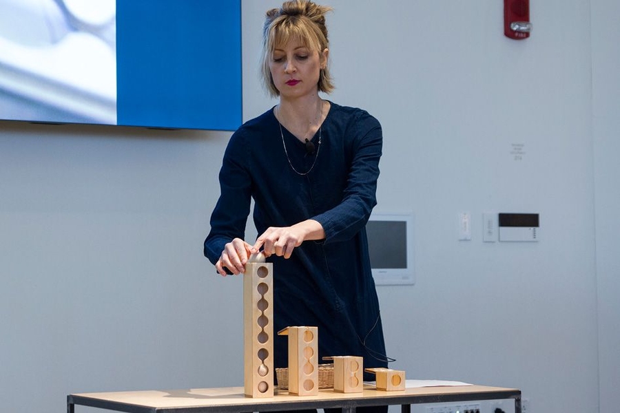 Kimberly Smith, a member of the Learning Beautiful team and a graduate student in the Social Computing Group at the MIT Media Lab, demonstrates devices for hands-on learning materials for young children to learn about computation.