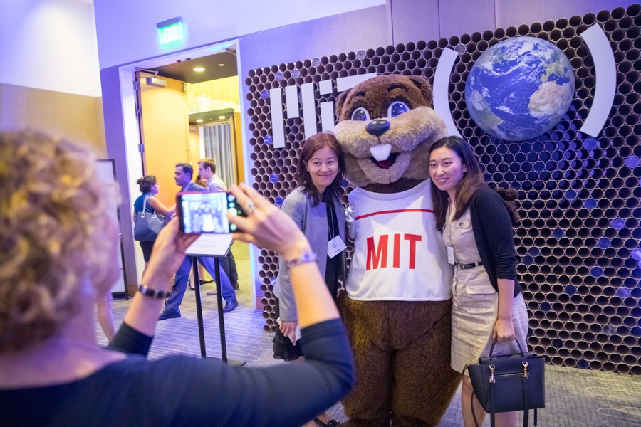 Guests pose for a photo with Tim the Beaver.