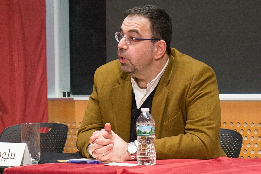Daron Acemoglu (left), the Elizabeth and James Killian Professor of Economics at MIT, at the Starr Forum.