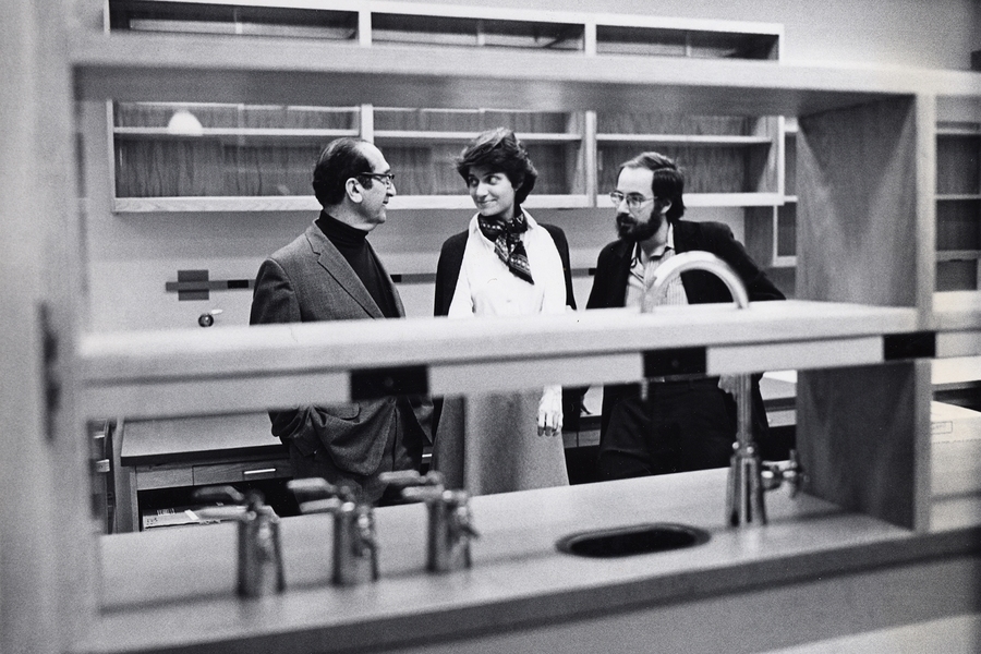 Nancy Hopkins (center) stands with Salvador Luria (left) and David Baltimore at the MIT Cancer Center in the 1980s.