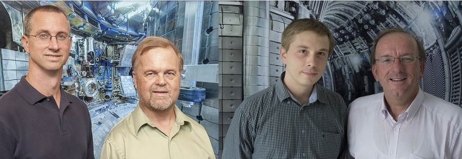 Steven Wukitch and John Wright (left) in front of an interior shot of Alcator C-Mod, with Yevgen Kazakov and Jef Ongena, from Laboratory for Plasma Physics, in front of an interior shot of JET. The four researchers collaborated on these two devices to gain insights into plasma heating.