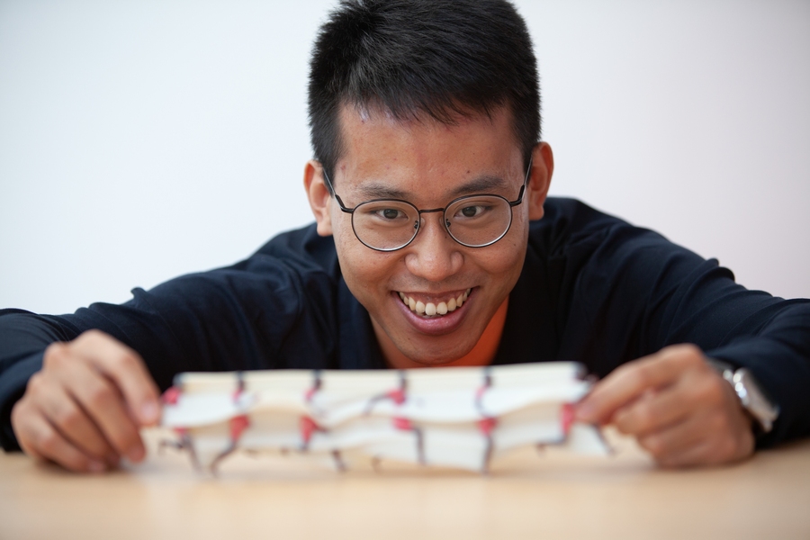 Lead author Xiuming Zhang with one of the team's "motion sculptures"