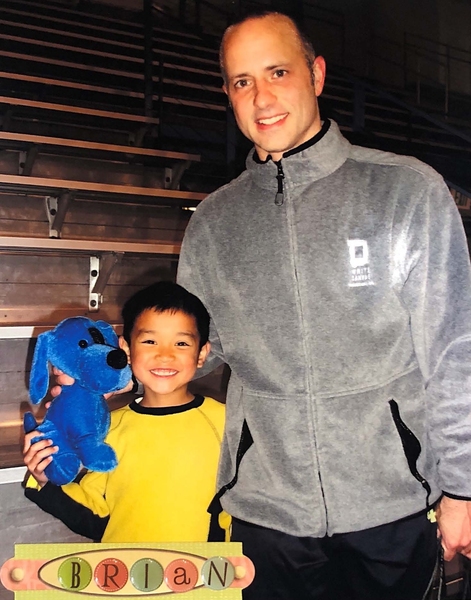 A young Kevin Shum meets American figure skater and1988 Olympic champion Brian Boitano.