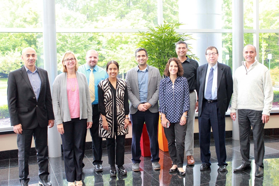 Members of the Health Analytics Collective: (left to right) Mohamad Zahreddine, Michelle Gayari, Duane Robinson, Uma Sharma, Vijay Ivaturi, Kelly Hill, Joga Gobburu, Alan Edelman, and Prasad Koppolu, gather at MMS Holdings in Canton, Michigan.