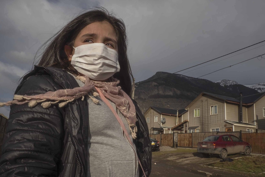 Natalie Galindo, 10, has severe asthma and most trips outside her home in the town of Coyhaique, Chile, involve wearing a mask — or even a respirator.