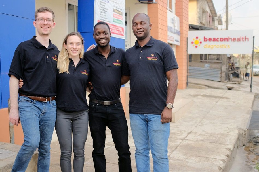 MDaaS Global co-founders in front of their clinic in Ibadan, Nigeria. From left to right: Joe McCord SM ’15, Genevieve Barnard Oni MBA ’19, Oluwasoga (Soga) Oni SM ’16, and Opeyemi Ologun.