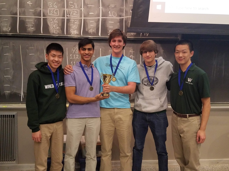Participants from Westminster Schools in Atlanta raise their winning trophy at the end of the first MIT Science Bowl Invitational.