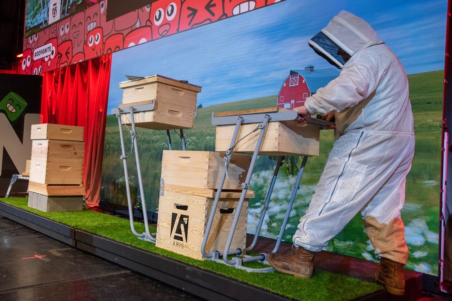 Beekeeping hobbyist Tony Pulsone demonstrates Aris, a lifting apparatus to help beekeepers maneuver heavy crates of bees and honey.