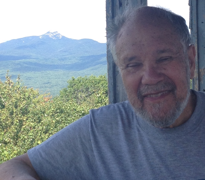 Aron Bernstein in 2015, on the fire tower at the top of Mt. Chocorua in New Hampshire