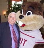 Paul Honiker, a campaign solicitor for the Controller's Accounting        Office, poses with the MIT beaver at a celebration hosted by Mrs. Rebecca Vest on Feb. 6.