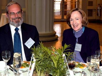 W. Eric Grimson, left, asssociate department head in electrical engineering and computer science, shares a moment with President Susan Hockfield at the Quarter Century Club induction lunch, held at Walker Memorial on Monday, April 11.