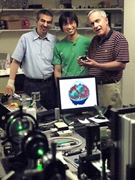 From left: Kamran Badizadegan, principal research scientist; Wonshik Choi, postdoc; and Michael Feld, physics professor and director of the MIT Spectroscopy Lab. The three have found a way to create 3D images of the inner workings of cells, as illustrated on monitor in front of them.