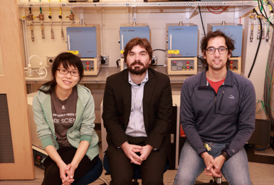 Synthesizing new physics: MIT assistant professor of physics Joseph Checkelsky (center) and graduate students Linda Ye (left) and Aravind Devarakonda are working to uncover new properties linked to collective behavior of electrons. Their work blends materials science and solid state physics and makes extensive use of high-temperature furnaces (behind them in photo) to produce interesting new compo...