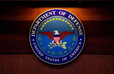 DOD seal. Center contains an eagle against a blue background. Perimeter says "Department of Defense; United States of America."