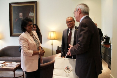 The president of Mauritius, Ameenah Gurib-Fakim (left), meets MIT President L. Rafael Reif (right), on Friday, April 7, at MIT. Sooroojdev Phokeer, the Mauritius ambassador to the U.S., stands in the background (center).