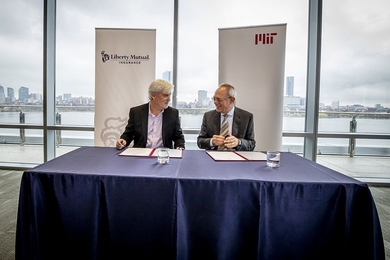 MIT and Liberty Mutual Insurance announced a $25 million, five-year collaboration to support intelligence research at a meeting on Tuesday attended by Liberty Mutual Chairman and CEO David Long (left) and MIT President L. Rafael Reif. 