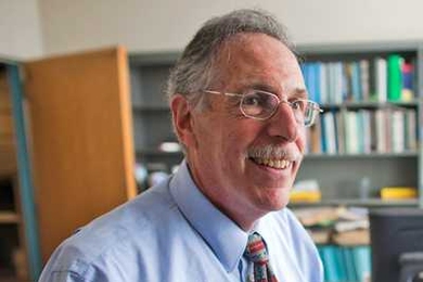 Economist Peter A. Diamond takes phone calls and relaxes in his office after a press conference announcing that he, and two others, were awarded the Nobel Prize in Economics Monday.