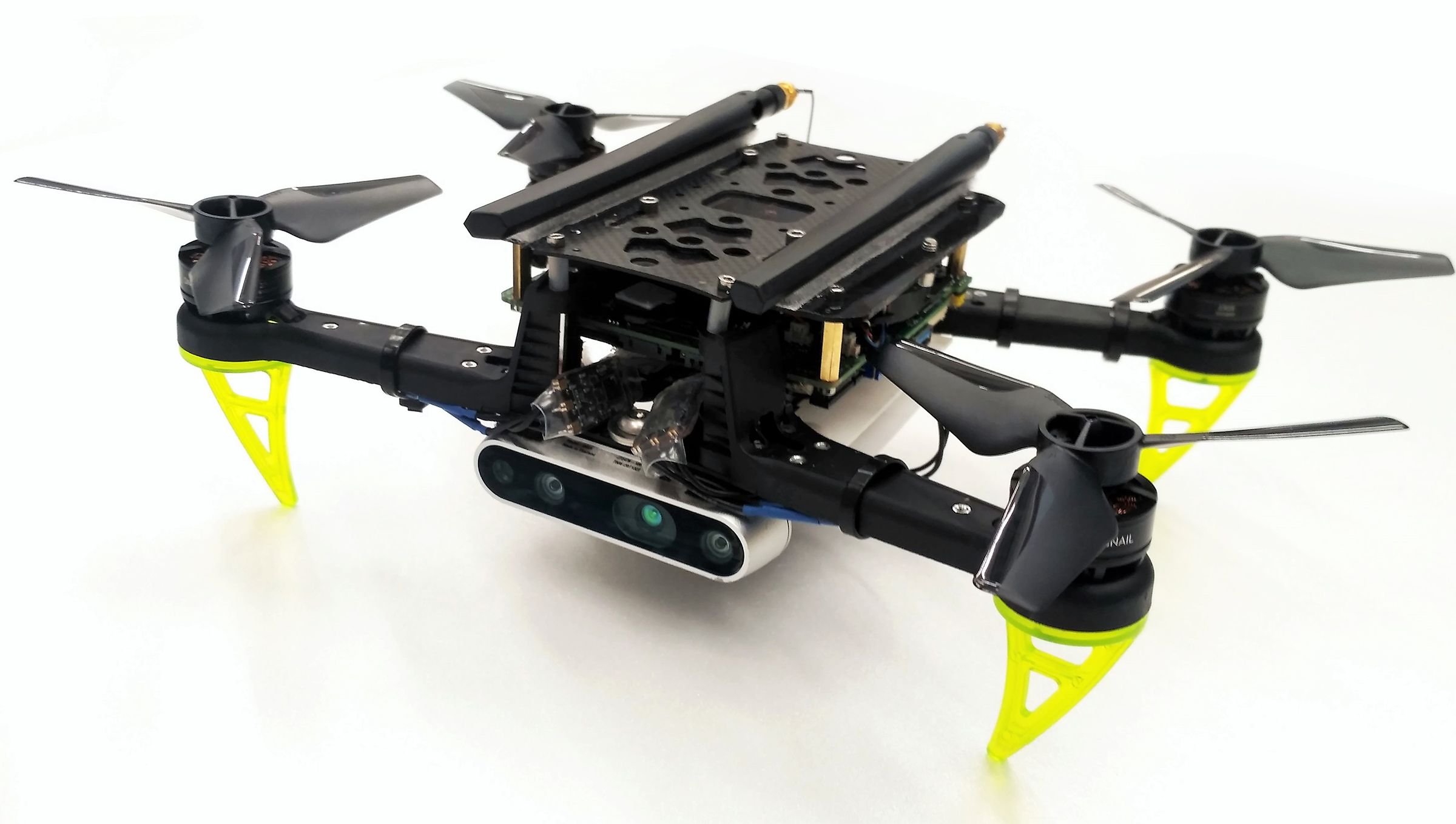 Stanford's micro-drones can grab and haul heavy loads, open doors