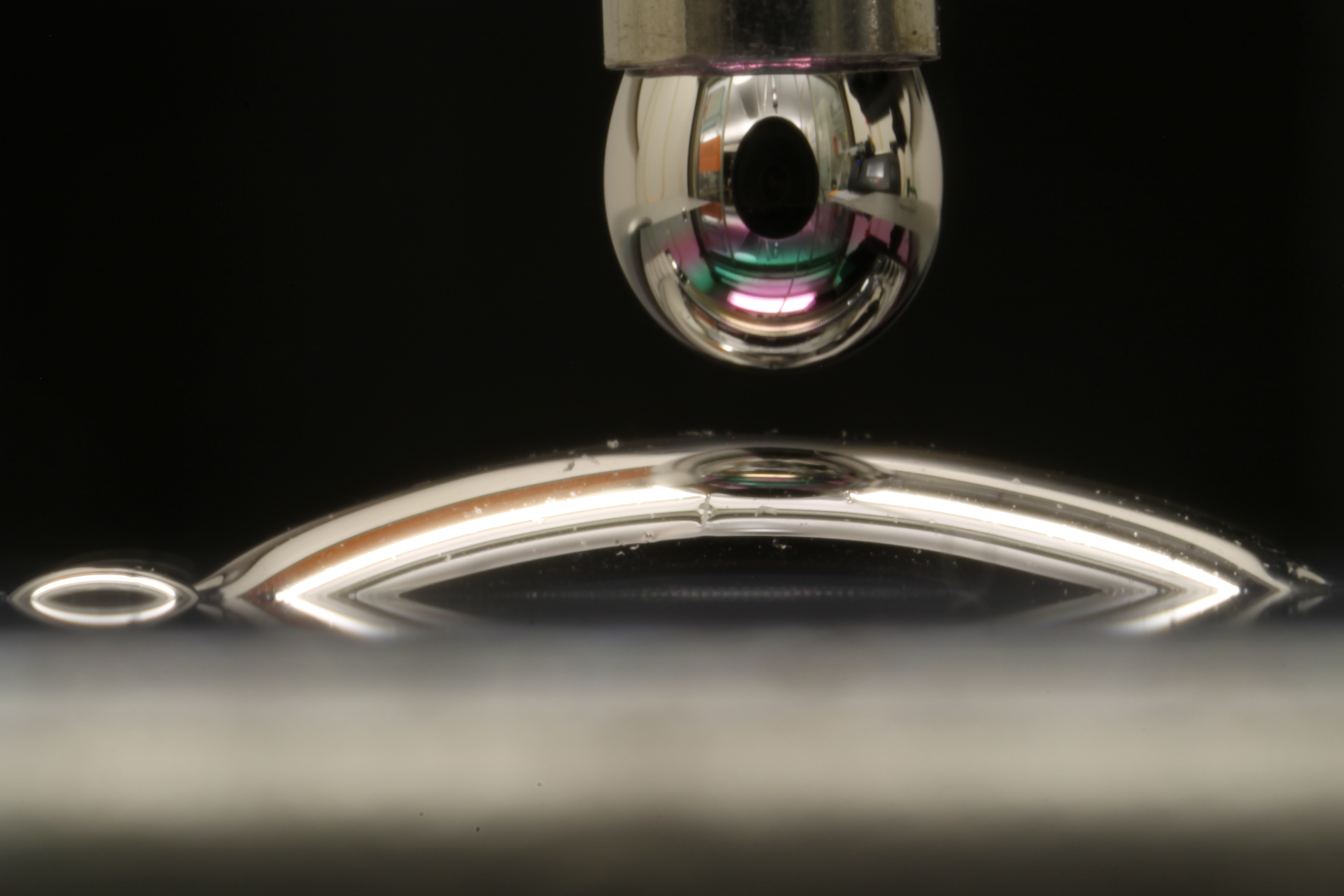 Controlling how “odd couple” surfaces and liquids interact - MIT News
