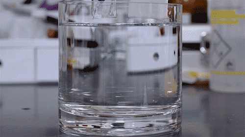 The white piece floats on top of water while the clear piece sinks.
