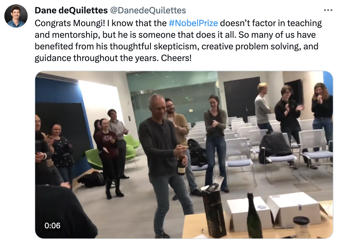 X post from Dane DeQuilettes with a video still of Moungi Bawendi popping champagne with more than a dozen others indoors. Text: Congrats Moungi! I know that the #NobelPrize doesn’t factor in teaching and mentorship, but he is someone that does it all. So many of us have benefited from his thoughtful skepticism, creative problem solving, and guidance throughout the years. Cheers!