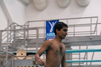 Srikanth Bolla ’13 jumps off the diving board for the first time in the MIT Beginner's Swim class.