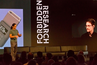 The MIT Media Lab held a symposium on July 21 to explore the “fuzzy line” between disobedience that helps society and disobedience that doesn't. Andrew “bunnie” Huang (left) and Edward Snowden presented their technology to turn journalists’ smartphones into “cyber fortresses.”